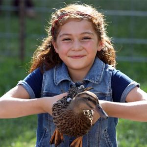 girl holding duck